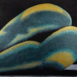 Abstract sculpture resembling organic, flowing forms in blue and yellow hues.